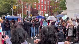 Woman pronouncing speech at rally in solidarity with Iranian protesters in New York, USA