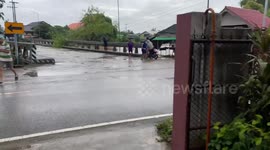 Tree washed away in floods crashes into electricity line causing explosion in Thailand