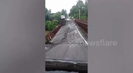 Bridge collapses when overloaded truck carrying sand drives across in the Philippines