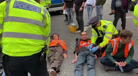 Climate activists glue their hands to road in London