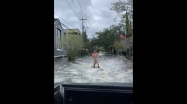 Man wakeboards in South Carolina streets during Hurricane Ian aftermath