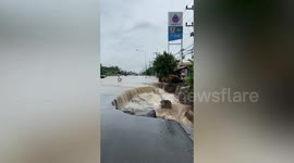 Chunk of road collapses due to heavy flood in central Thailand