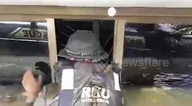 Volunteers rescue stray kitten trapped in empty flooded house in northeast Thailand