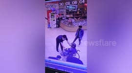 Men save elderly woman after wheelchair rapidly rolls down escalator