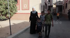Palestinian woman Asmaa Abu Tair, 34, who lost her leg, works on fashion design at her shop