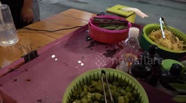 Thai restaurant mixes live goldfish with baskets of floating vegetables and noodles