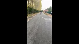 Cyclist attempting to wheelie on damp road faces hilarious fail