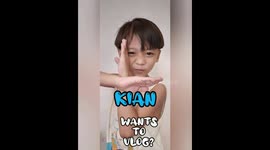 A 4 year old boy playing blocks while singing
