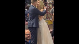 Hitched on the pitch! Newly married couple rush to Inter Barca match still wearing wedding attire