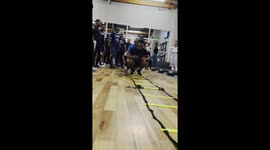 Man impressively outlasts his friends in tiring leg workout on three-tier ladder