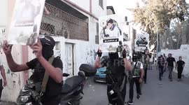 Militants of several military wings of the Palestinian factions take part in military parade marking the 35th anniversary of the Islamic Jihad movement founding