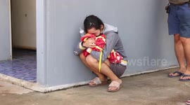 Heartbroken families lay flowers at scene of nursery massacre in Thailand