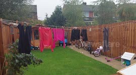 Heavy rain made all the washing soaking wet on the washing line in the garden Harrogate home England UK