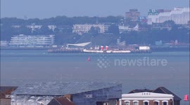 World's last seagoing paddle steamer seen alongside world's longest pleasure pier, UK