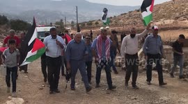 Palestinians protesters take part during a protest against the establishment of Israeli outposts