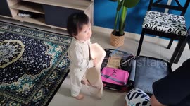 Funny Toddler Holding and Playing Mum's Bra