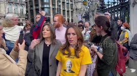 Julian Assange’s wife and children join huge protest in London outside UK Parliament