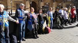 People form human chain in Westminster and Lambeth Bridge, London, to support Julian Assange