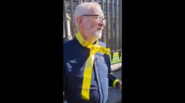 Jeremy Corbyn joins the human chain at Westminster for Julian Assange today in London