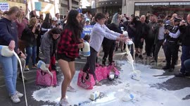 Animal Rebellion activists pour milk on the streets of London