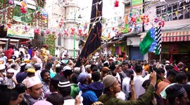 Muslim devotees participate in a procession on the occasion of Eid-e-Milad-un-Nabi