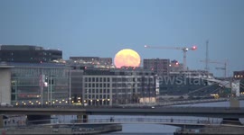Full Hunter's Moon captured at its most brilliant over London's Royal Docks
