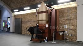 A pair of very talented members of the public playing the soundtrack of the movie Interstella on an organ located in London Bridge Underground Station