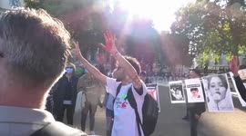 Iranian women chanting on Parliament Square during protest for Mahsa Amini