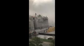 Smoke rises from destroyed building after missile hits Ukraine's Dnipro