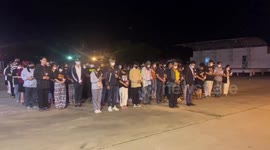 Students light candles for Thai nursery massacre victims