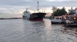 Out-of-control oil tanker veers towards riverside restaurant 'while avoiding barge' in Thailand
