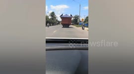 Entire house spotted on back of moving truck in Cambodia
