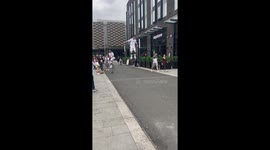 Circus artist entertains public by performing CRAZY acrobatics on bouncy stilts