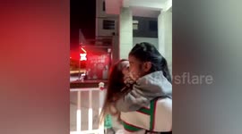 Girl runs into parents' arms as they return home after 3-year absence