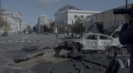 Charred remains of vehicles lie on roads after missile hit Kyiv during rush hour