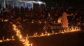 Mass prayers take place after Indonesian soccer match stampede leaves at least 125 dead