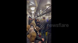 Ukrainians sheltering in Kyiv subway sing amid Russian missile attack