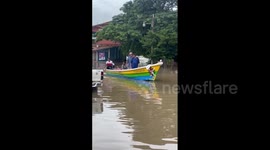 Locals boat through streets as deadly Storm Julia hits Honduras