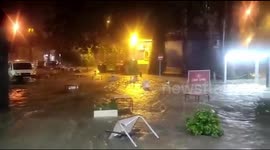 Tables and chairs float down street as flash road rages in Torrevieja, Spain