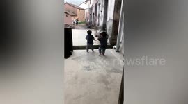 Excited twins break into a happy dance as older brother returns home