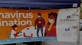 People Queues Up To Access Coronavirus Vaccination Mobile Bus in West London