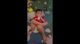 Baby sleeps in hilarious position while drinking from bottle