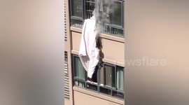 Residents pull burning quilt from upstairs neighbour's window to prevent flat from igniting