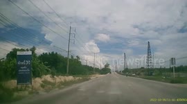 Concrete post falls onto highway in front of oncoming cars Thailand