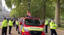Just Stop Oil activists climb on top of police vans in London