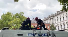 Pair of Just Stop Oil supporters arrested for climbing on Metropolitan Police van