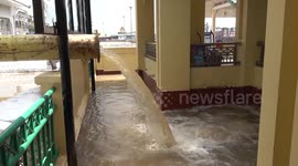 River overflows flooding homes in greater Bangkok following heavy rain across Thailand