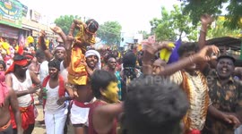 Devotees disguised  as Goddesses of destruction Kali danced in the temple festival in South India