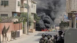Palestinian protesters clash with Israeli forces following the funeral of 18-year-old Palestinian killed a day earlier during clashes