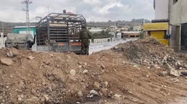 Israeli security forces mans a position at the entrance Deir Sharaf leading to Nablus